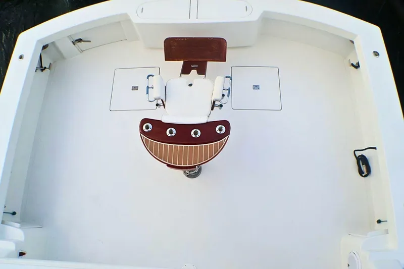  Yacht Photos Pics Cockpit of 2001 Donzi 73 Sport Yacht with central fishing chair and storage compartments.