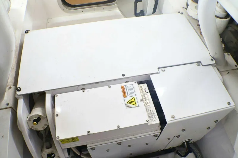  Yacht Photos Pics Engine compartment of a 2001 Donzi 73 Sport Yacht, featuring electrical components and warning labels.