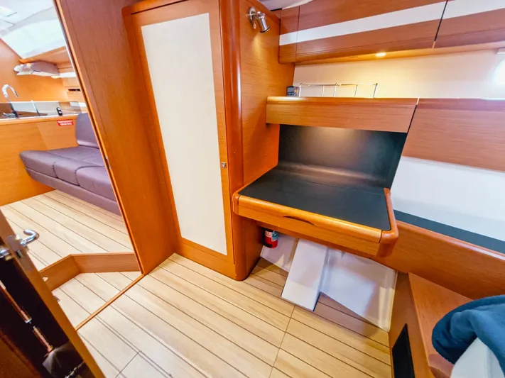  Yacht Photos Pics Interior of 2015 Jeanneau 53 yacht with wooden finish and modern design.