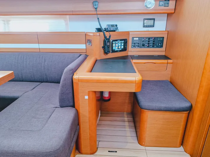  Yacht Photos Pics Interior of a 2015 Jeanneau 53 yacht with seating and navigation equipment.