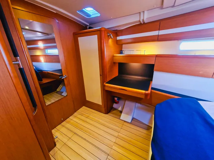  Yacht Photos Pics Luxurious interior of 2015 Jeanneau 53 yacht with wooden finish and modern amenities.