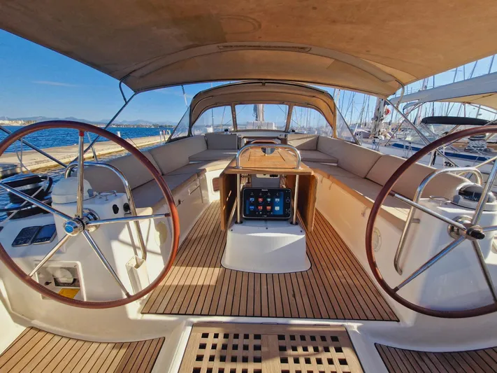  Yacht Photos Pics 2015 Jeanneau 53 yacht cockpit with dual steering wheels and spacious seating.