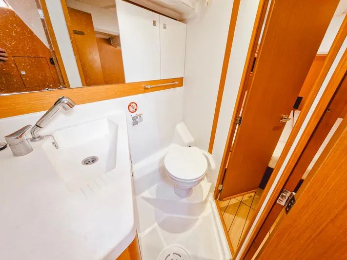  Yacht Photos Pics Bathroom interior of a 2015 Jeanneau 53 yacht, featuring a sink and toilet.