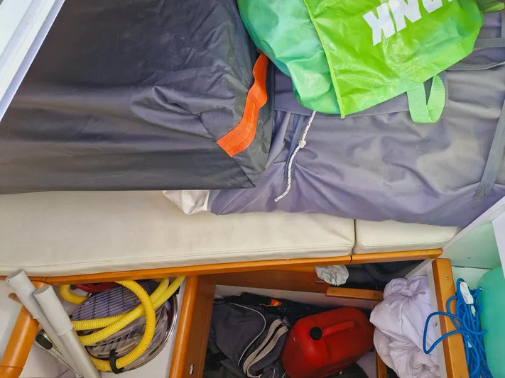  Yacht Photos Pics Storage area on a 2015 Jeanneau 53 yacht with bags and equipment.