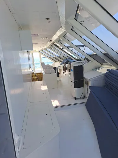 Salone Yacht Photos Pics 2015 Power Catamaran interior with helm, seating, and panoramic windows.