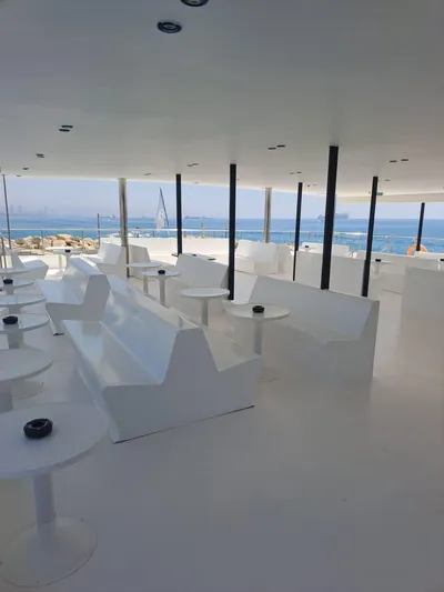 Salone Yacht Photos Pics Modern seating area on a 2015 Power Catamaran with ocean views.