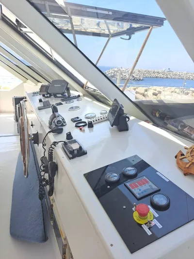 Salone Yacht Photos Pics 2015 Power Catamaran control panel with navigation equipment and ocean view.