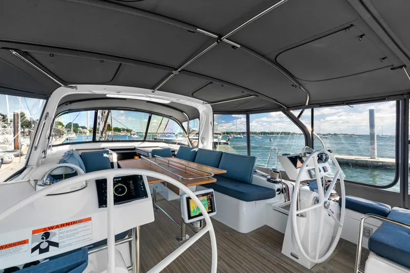 Dolce Vita Yacht Photos Pics 2016 Beneteau Oceanis 60 yacht cockpit with dual steering wheels and spacious seating.