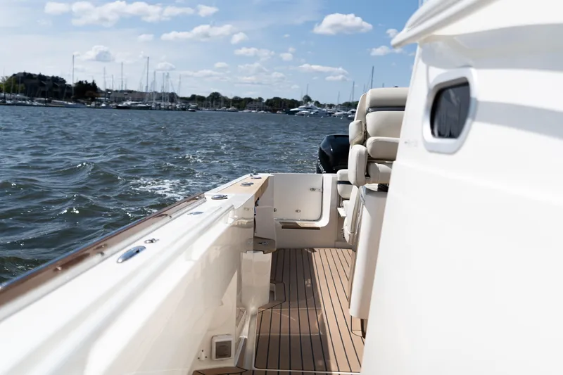 Hunt 32cc-035 Yacht Photos Pics 2019 Hunt Yachts 32CC on water, showcasing sleek deck and seating.