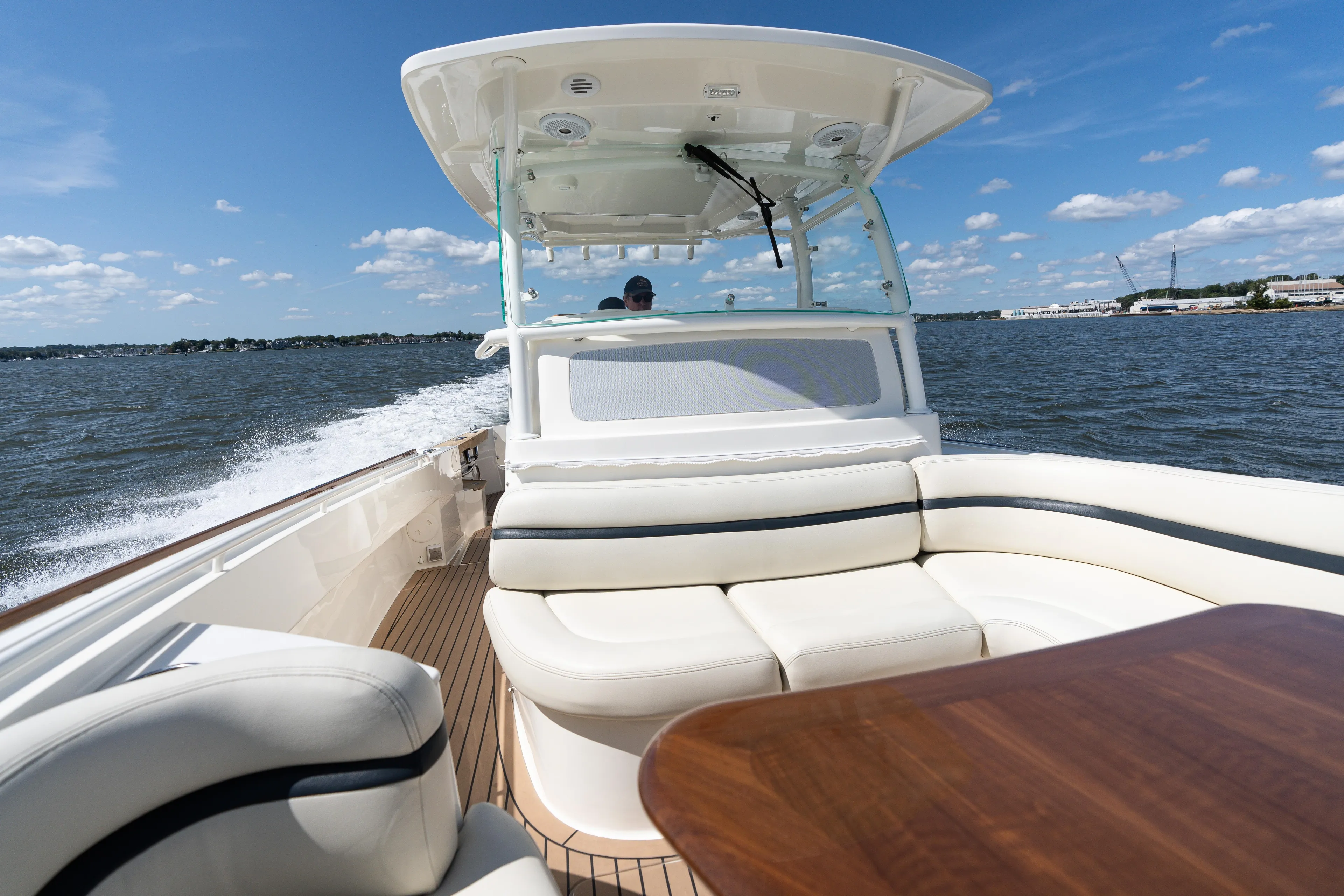 Hunt 32cc-035 Yacht Photos Pics 2019 Hunt Yachts 32CC cruising on open water, featuring luxurious seating and sleek design.