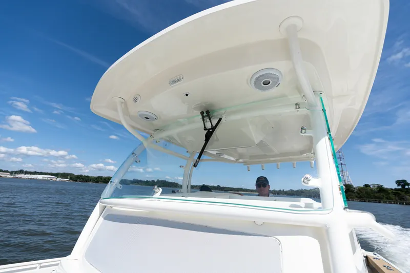 Hunt 32cc-035 Yacht Photos Pics 2019 Hunt Yachts 32CC on water, featuring sleek design and modern canopy.