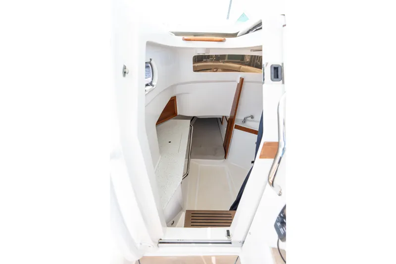 Hunt 32cc-035 Yacht Photos Pics 2019 Hunt Yachts 32CC cabin interior with white and wood accents.