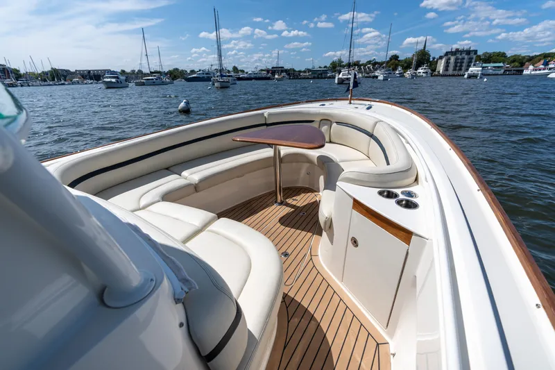 Hunt 32cc-035 Yacht Photos Pics Luxurious 2019 Hunt Yachts 32CC boat interior with elegant seating and wooden deck.