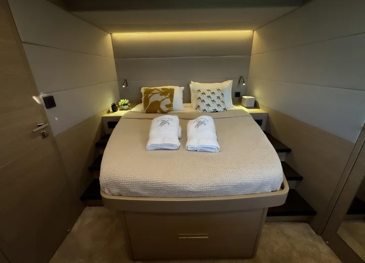 Esperance Yacht Photos Pics Luxurious bedroom interior of 2024 Lagoon 55 yacht with cozy bedding and ambient lighting.