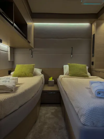 Esperance Yacht Photos Pics Luxurious twin cabin interior of 2024 Lagoon 55 yacht with modern design and ambient lighting.