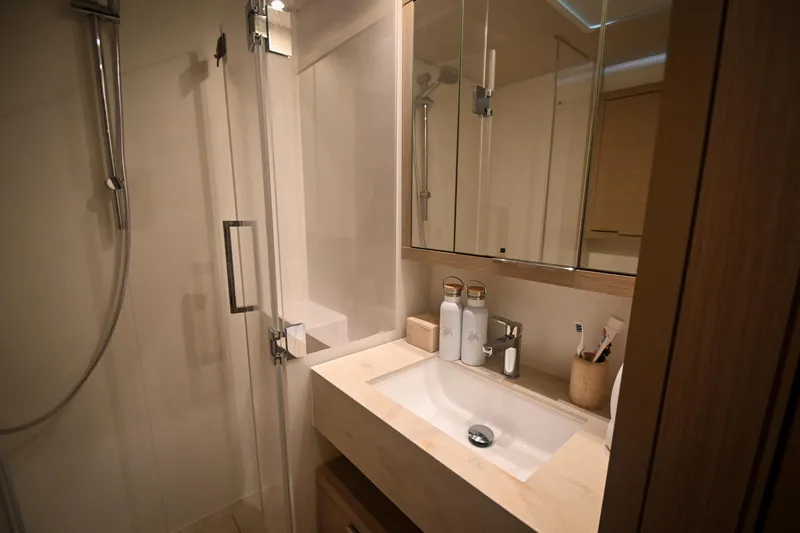 Esperance Yacht Photos Pics Modern bathroom in 2024 Lagoon 55 yacht with sleek sink and shower.