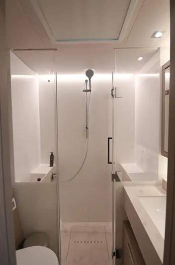 Esperance Yacht Photos Pics Modern bathroom interior of 2024 Lagoon 55 yacht, featuring sleek shower and elegant design.