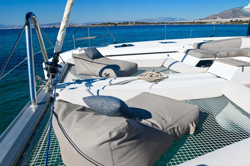 Esperance Yacht Photos Pics Luxurious 2024 Lagoon 55 yacht deck with comfortable seating and ocean view.