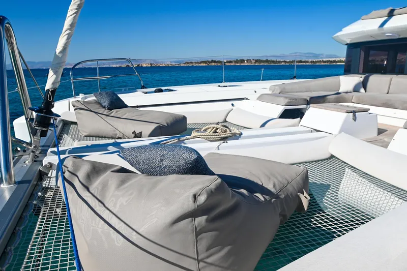 Esperance Yacht Photos Pics Luxurious 2024 Lagoon 55 yacht deck with comfortable seating and ocean view.