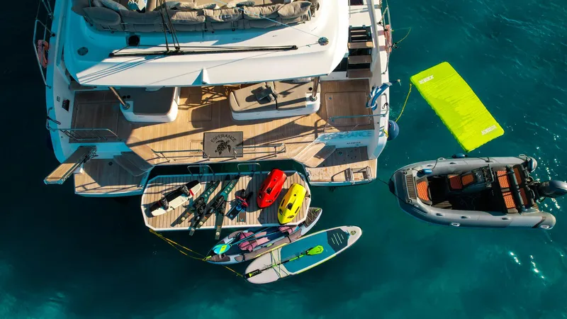 Esperance Yacht Photos Pics Aerial view of 2024 Lagoon 55 yacht with water sports equipment and inflatable boat.