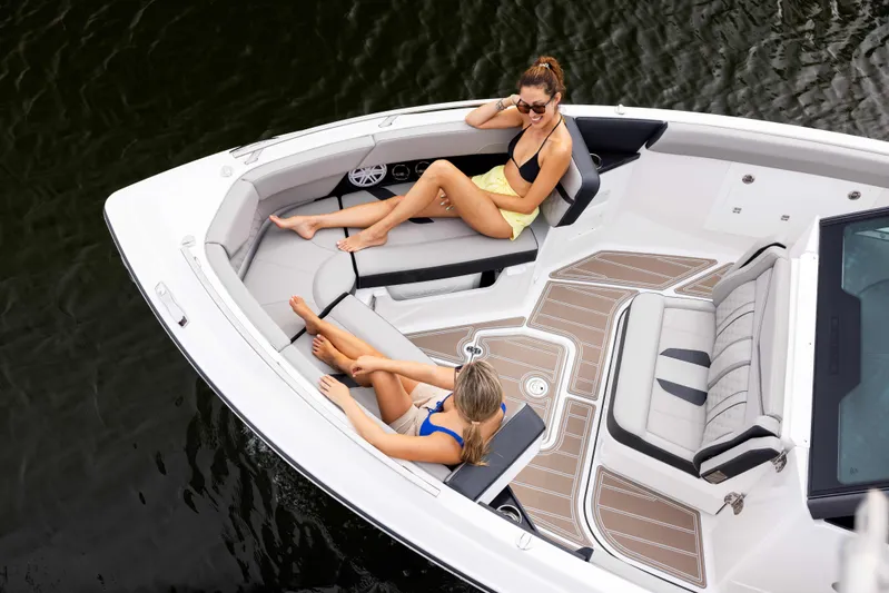  Yacht Photos Pics Two people relaxing on a 2026 Monterey ELITE 30 boat in the water.