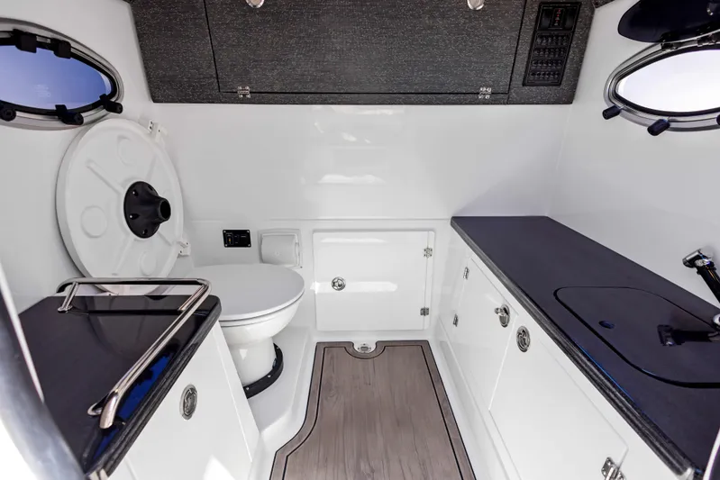  Yacht Photos Pics Modern bathroom interior of 2026 Monterey ELITE 30 boat, featuring sleek design and compact amenities.