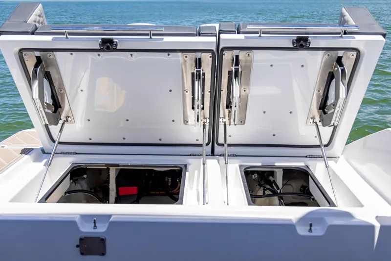  Yacht Photos Pics Open storage compartments on a 2026 Monterey ELITE 30 boat, showcasing interior features.
