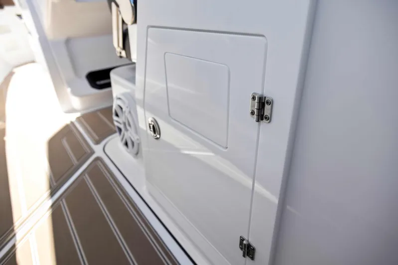  Yacht Photos Pics 2026 Monterey ELITE 30 boat interior with storage compartment and speaker.