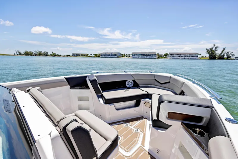  Yacht Photos Pics Luxury seating on 2026 Monterey ELITE 30 boat, with scenic water view.