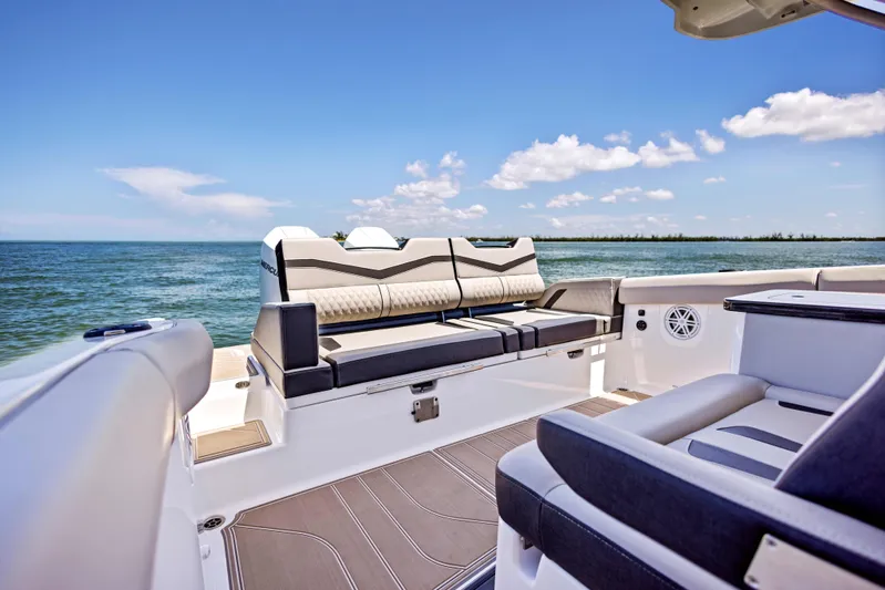  Yacht Photos Pics Luxury seating on 2026 Monterey ELITE 30 boat, ocean view, clear sky.