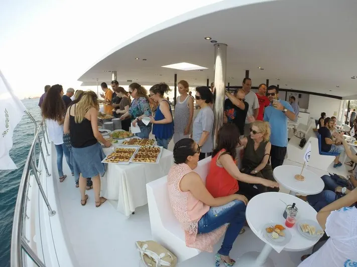 Salone Yacht Photos Pics People enjoying a party on a 2015 Power Catamaran yacht.