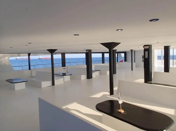 Salone Yacht Photos Pics Spacious interior of a 2015 Power Catamaran with ocean view.