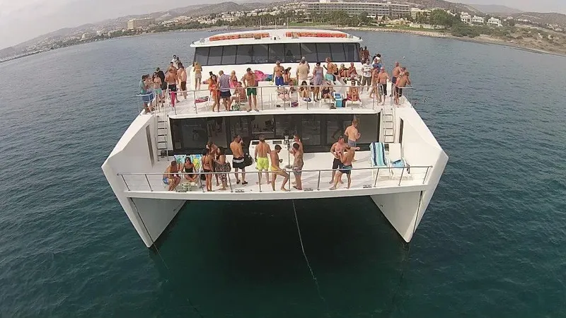 Salone Yacht Photos Pics People enjoying a party on a 2015 Power Catamaran in the ocean.