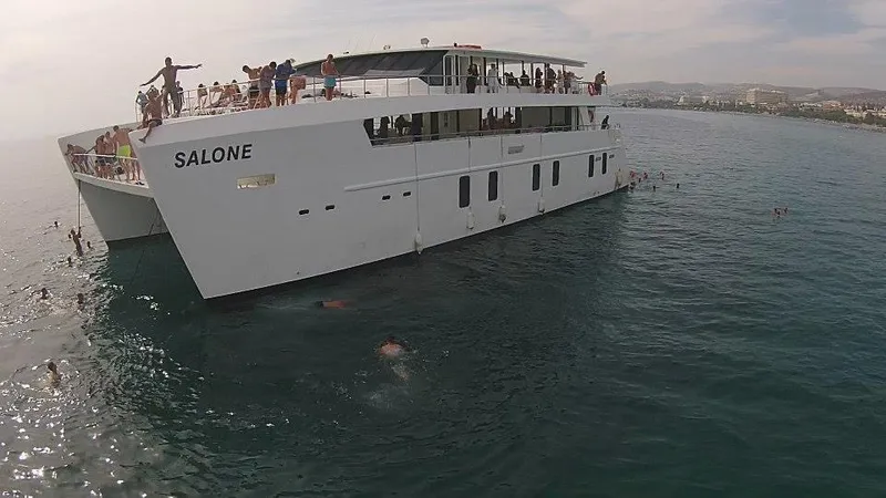 Salone Yacht Photos Pics 2015 Power Catamaran 'Salone' with people swimming and enjoying the sea.