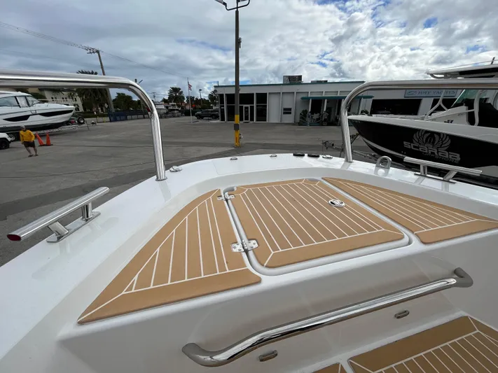 In-stock 2024 Nimbus C9 #136 Yacht Photos Pics 2024 Nimbus Commuter 9 #136 boat deck with tan and white design.