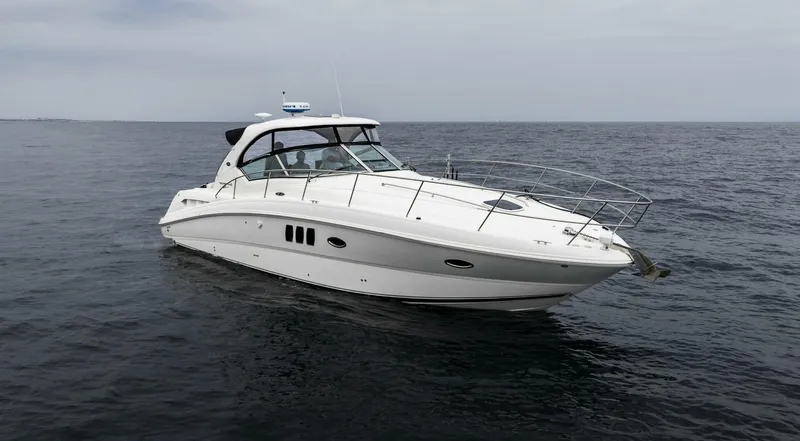  Yacht Photos Pics 2008 Sea Ray 38 Sundancer yacht cruising on open water.