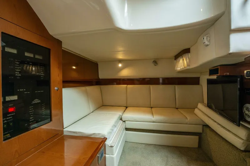  Yacht Photos Pics Interior of 2008 Sea Ray 38 Sundancer yacht with beige seating and wooden cabinetry.