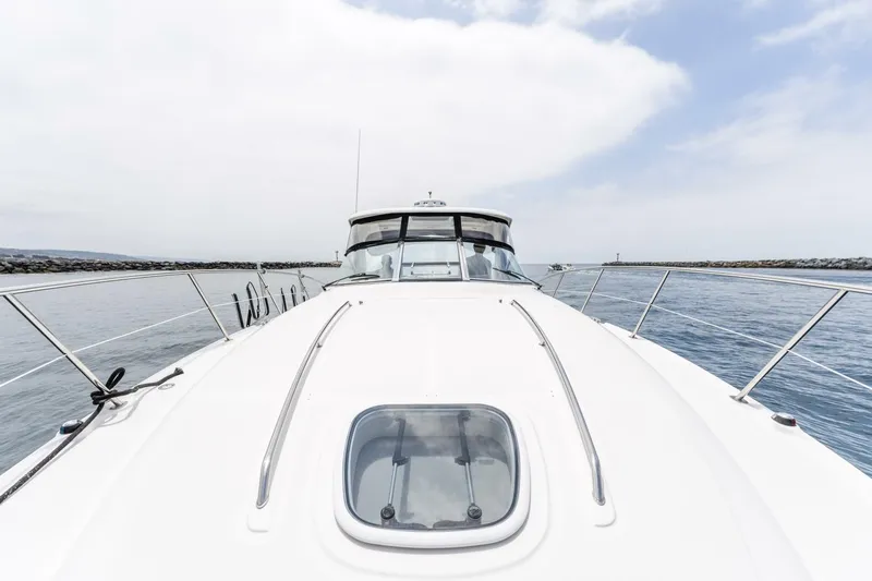  Yacht Photos Pics 2008 Sea Ray 38 Sundancer yacht on calm water, showcasing sleek design and spacious deck.