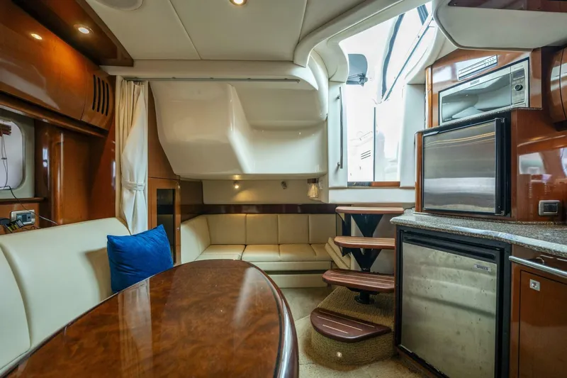 Yacht Photos Pics Luxurious interior of 2008 Sea Ray 38 Sundancer yacht with modern kitchen and seating area.