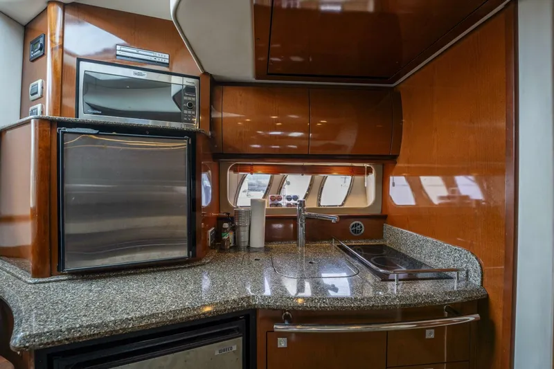  Yacht Photos Pics Luxurious 2008 Sea Ray 38 Sundancer yacht kitchen with modern appliances and sleek cabinetry.