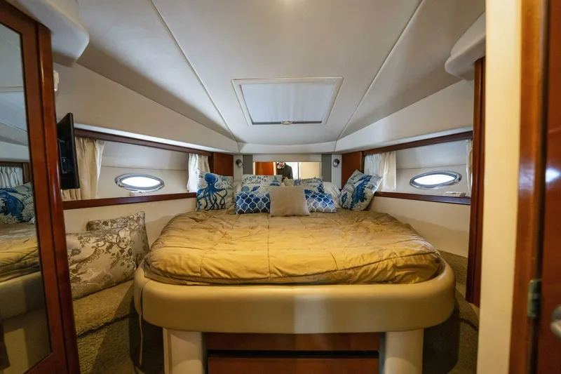  Yacht Photos Pics Luxurious cabin interior of 2008 Sea Ray 38 Sundancer yacht with plush bedding.