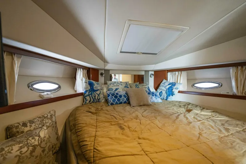  Yacht Photos Pics Luxurious cabin interior of 2008 Sea Ray 38 Sundancer yacht with plush bedding.