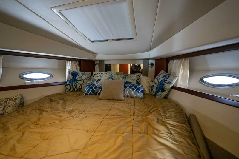  Yacht Photos Pics Luxurious cabin interior of 2008 Sea Ray 38 Sundancer yacht with cozy bedding.