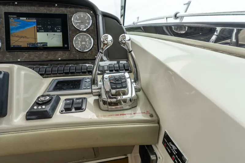  Yacht Photos Pics Control panel of 2008 Sea Ray 38 Sundancer yacht with navigation display and throttle levers.