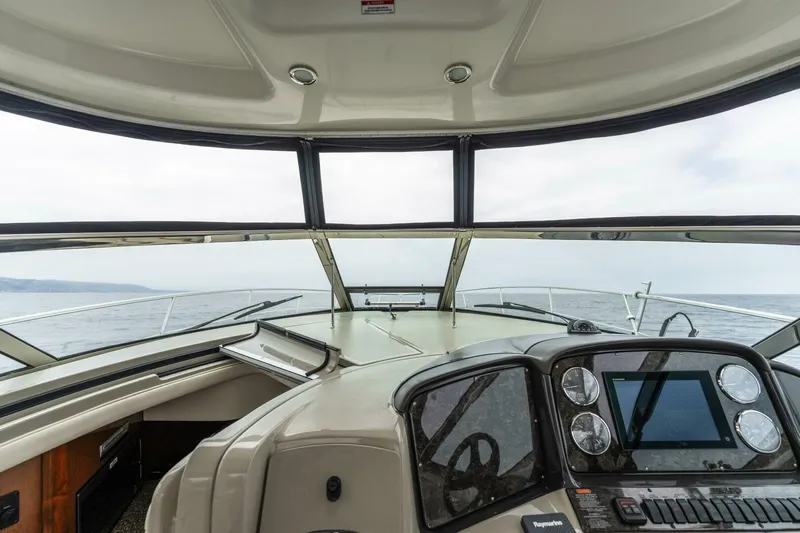  Yacht Photos Pics 2008 Sea Ray 38 Sundancer helm with navigation instruments and panoramic sea view.