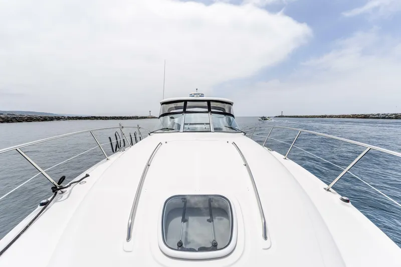  Yacht Photos Pics 2008 Sea Ray 38 Sundancer yacht cruising on open water under a cloudy sky.