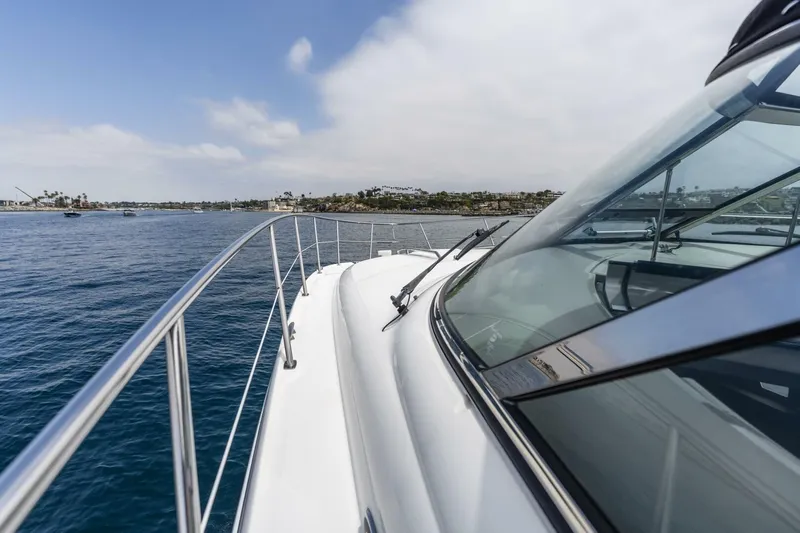  Yacht Photos Pics 2008 Sea Ray 38 Sundancer yacht cruising on calm blue waters.