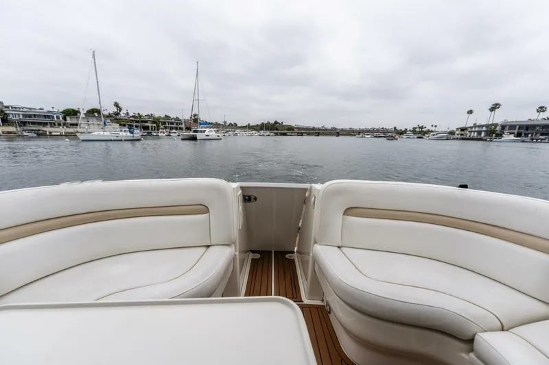  Yacht Photos Pics 2008 Sea Ray 38 Sundancer yacht interior with white seating, overlooking a marina.
