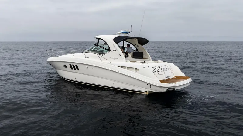  Yacht Photos Pics 2008 Sea Ray 38 Sundancer yacht cruising on open water.