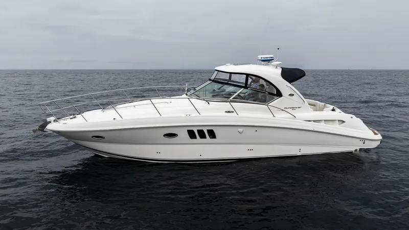  Yacht Photos Pics 2008 Sea Ray 38 Sundancer yacht cruising on open water.